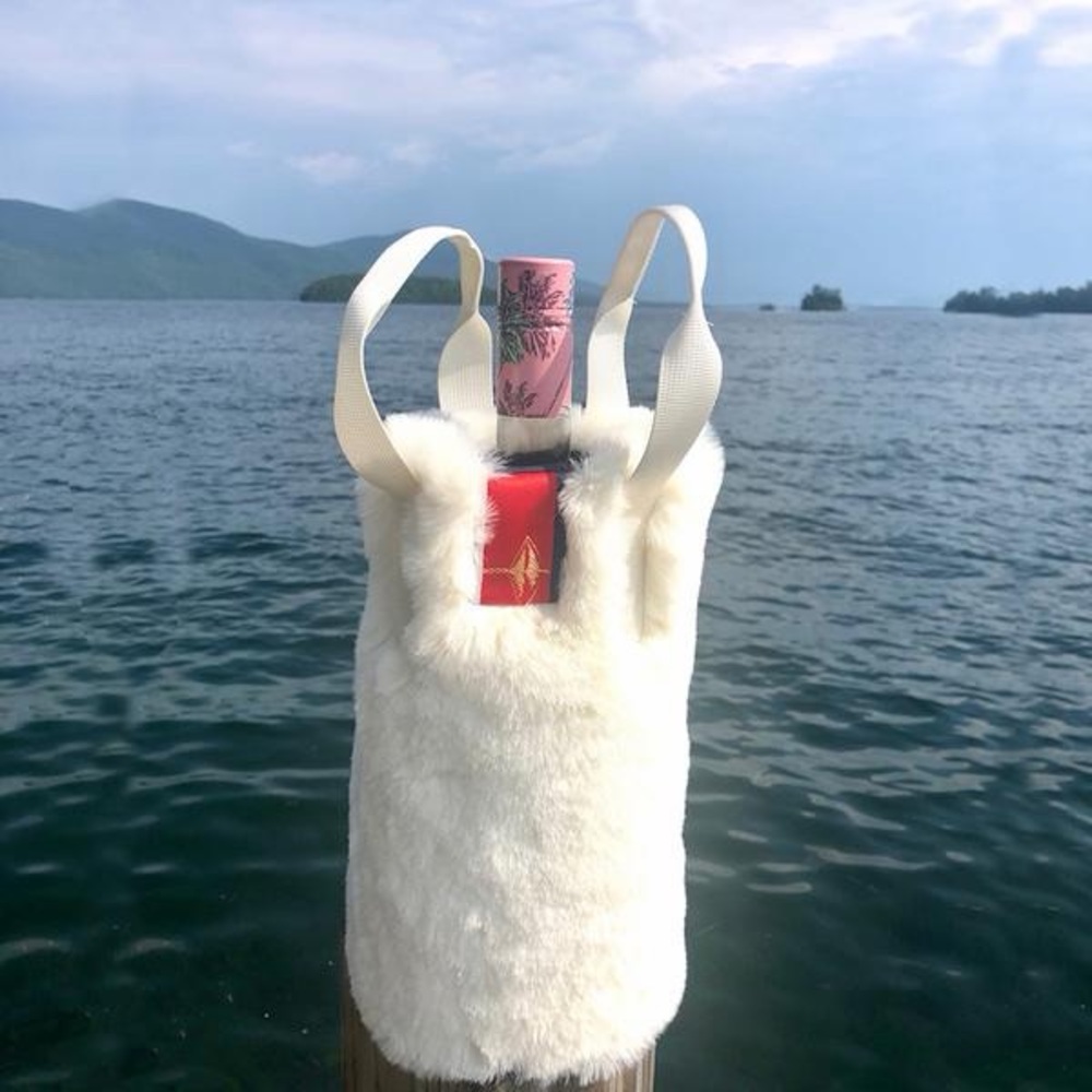 Pretty Rugged White Faux Fur Tote Bag. Signature red, blue, gold ribbon label